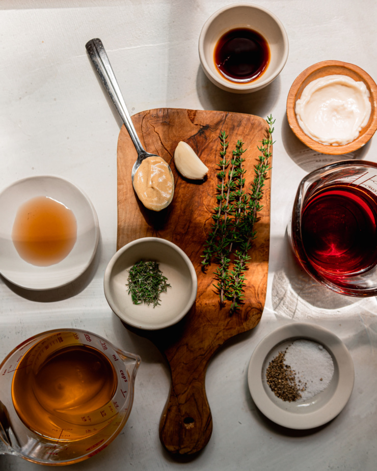 An overhead shot shows ingredients used in a homemade salad dressing.