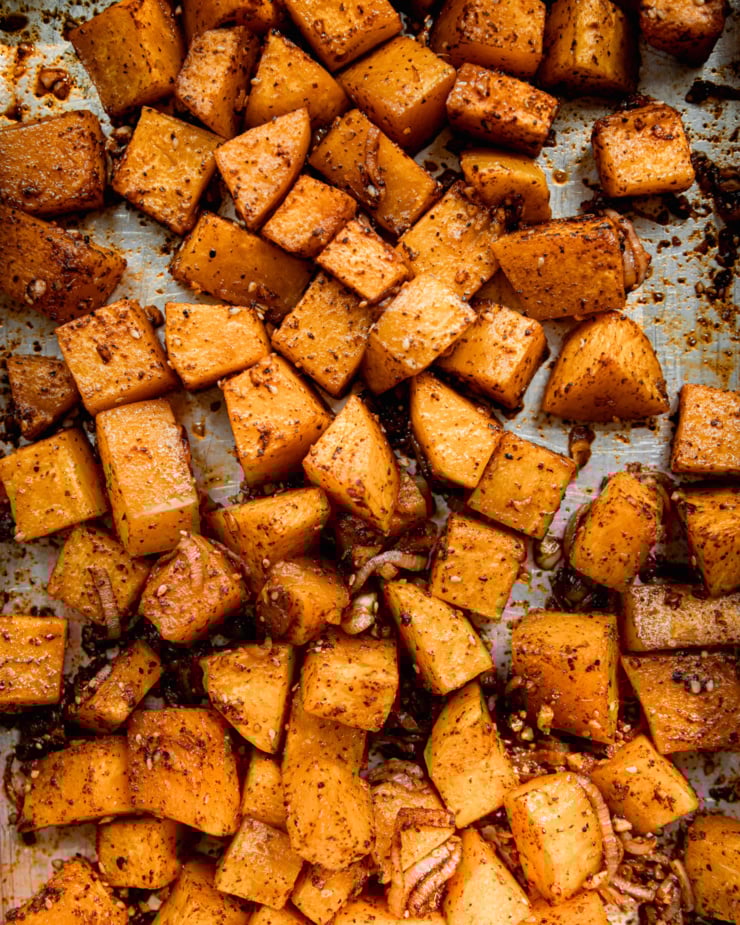 An overhead shot shows spiced roasted cubes of butternut squash.