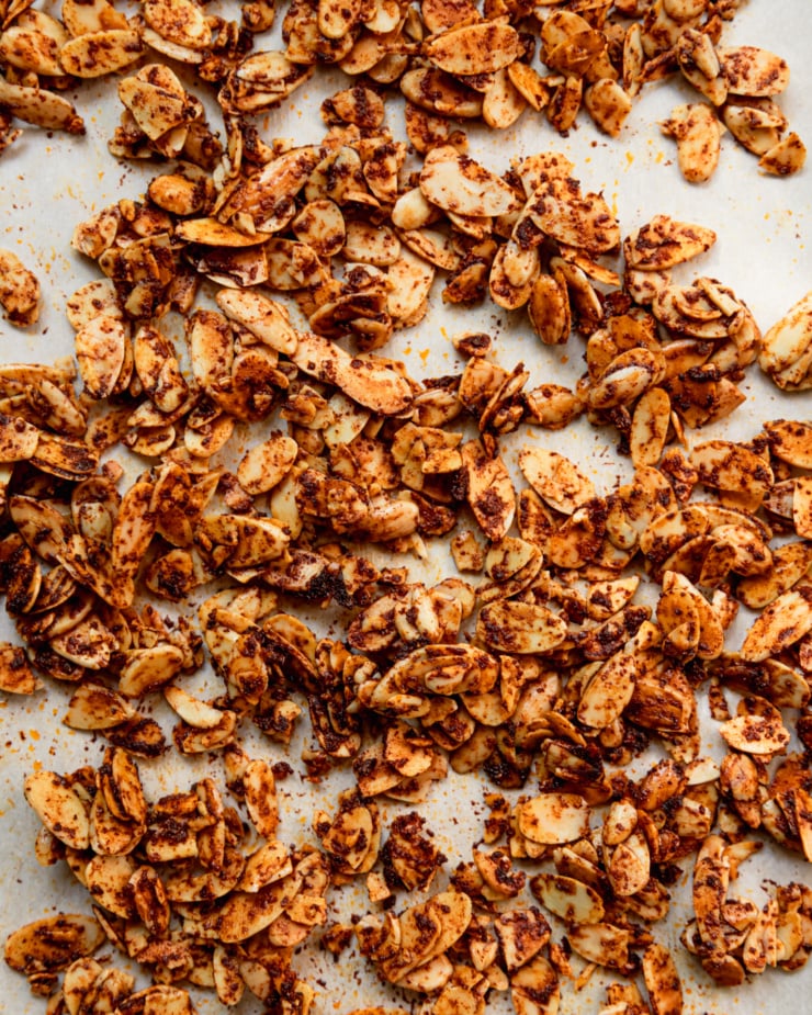 An overhead shot shows smoky maple almond slices coated in spices.