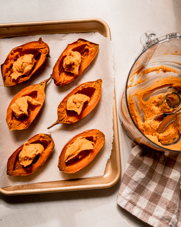 An overhead shot shows sweet potato "boats" being filled with a sweet potato, tahini, chili, and lime filling.