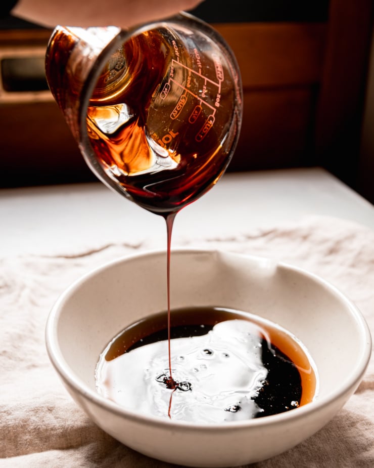 A head-on shot shows molasses being poured into a bowl.