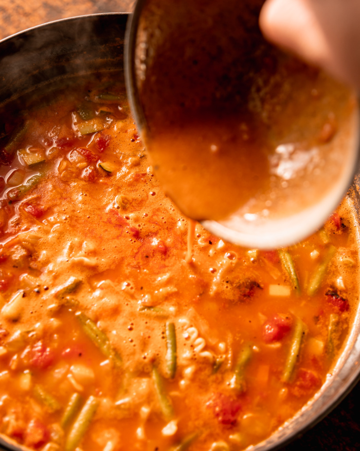 A 3/4 angle image shows miso-enriched stock being poured into a pot of soup.