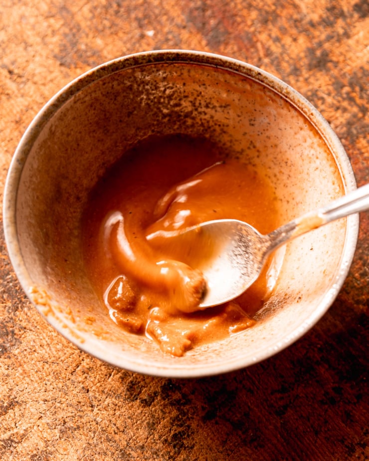 An overhead image shows a spoon stirring miso into hot water to dissolve.