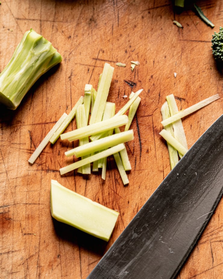 An overhead shot shows broccoli stalks that have been julienned into "slaw"