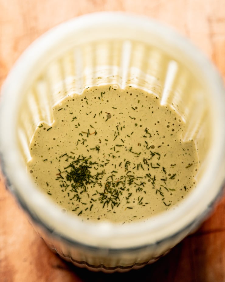An overhead shot shows the blended up creamy dill and dill pickle dressing.