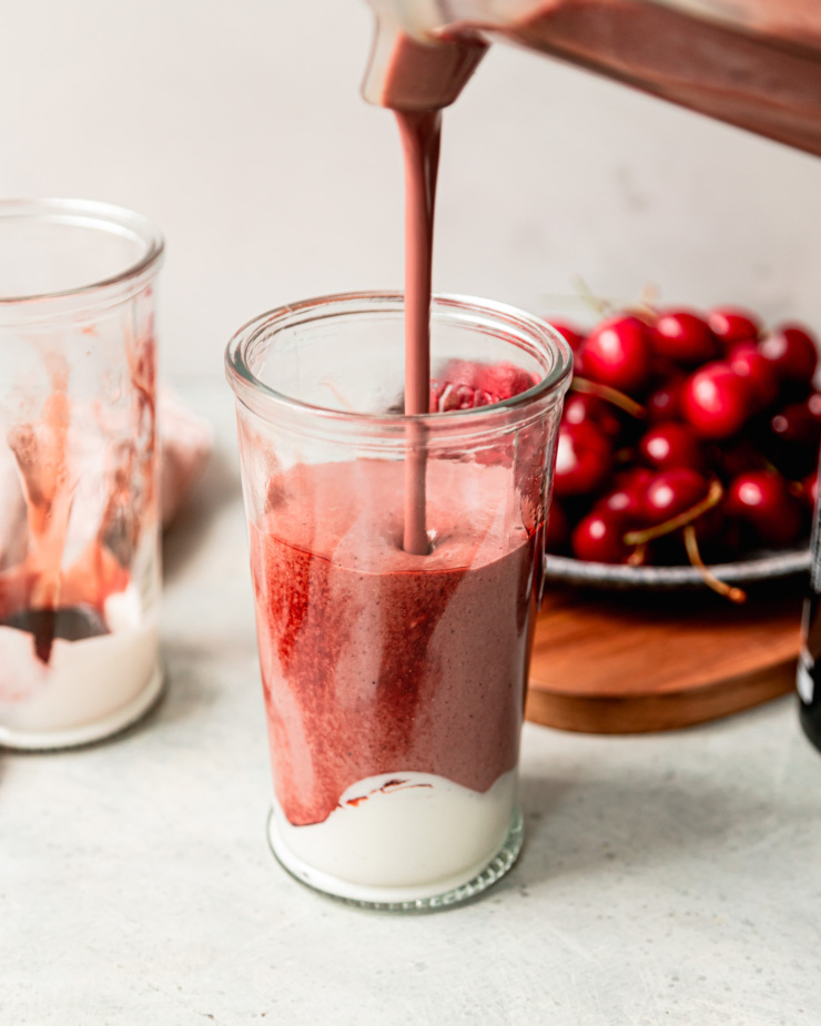 A head-on shot shows a smoothie being poured into a glass.