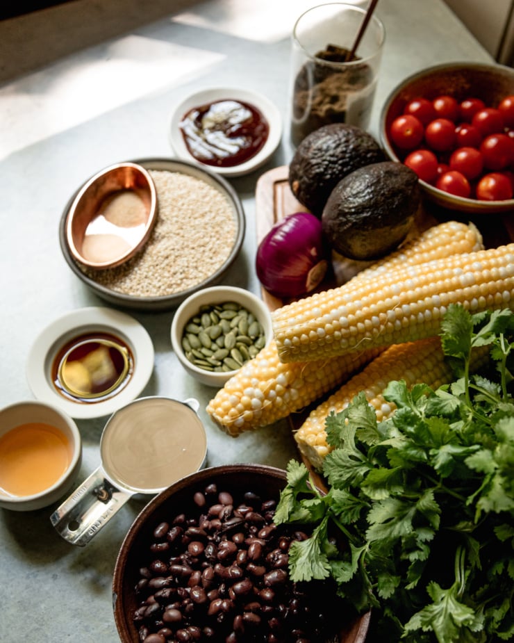 An overhead shot shows a section of ingredients for a corn quinoa salad.