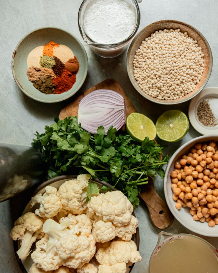 An overhead shot shows ingredients for a vegan stew-like dish.