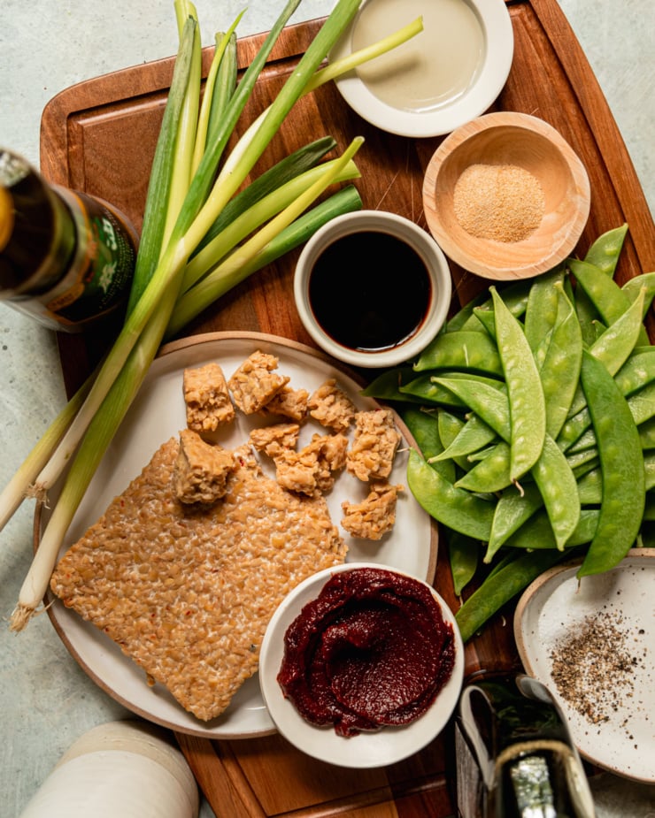 An overhead shot shows ingredients for a vegan meal with