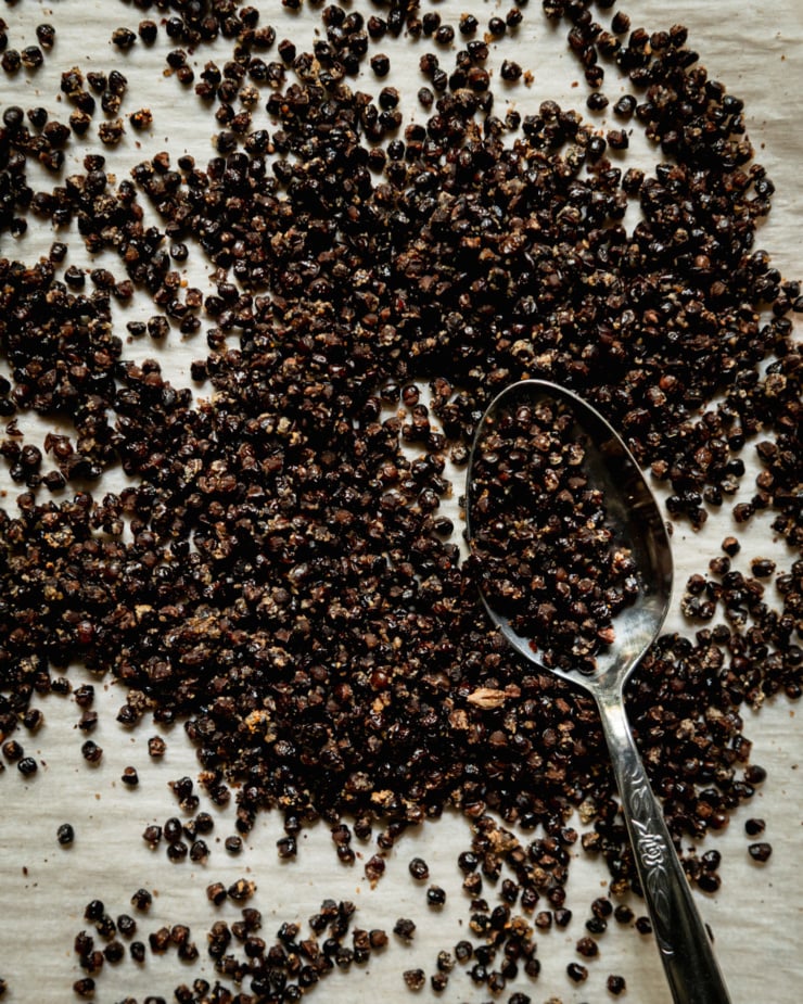 An overhead shot shows roasted lentils on a sheetpan.