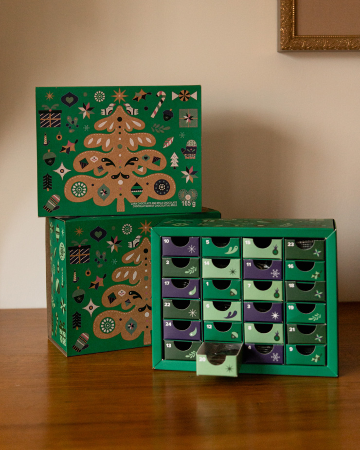 A head-on shot shows two vegan advent calendars with a Christmas tree motif.