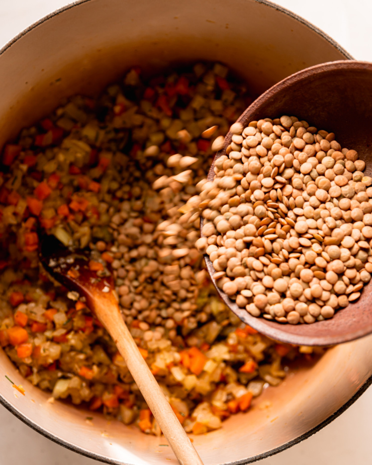 An overhead shot shows green lentils being poured into a pot with sautéed vegetables.