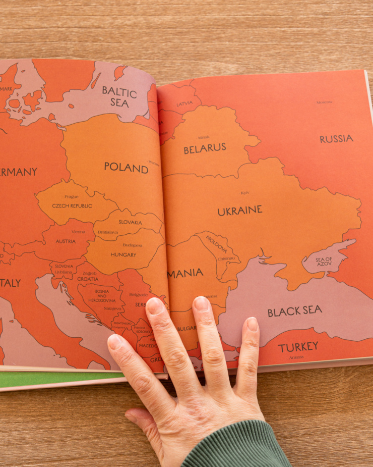 An overhead shot shows a map from the cookbook "Kapusta" showing Eastern Europe.