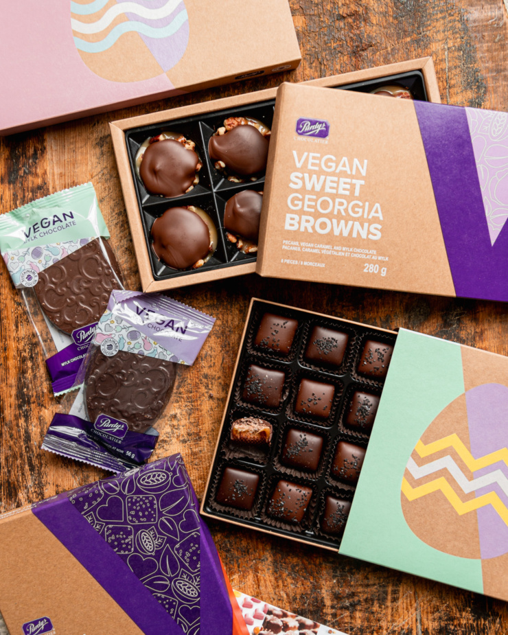 An overhead shot shows a variety of Purdy's vegan chocolates, including black salt caramels, sweet Georgia browns, and chocolate easter eggs.