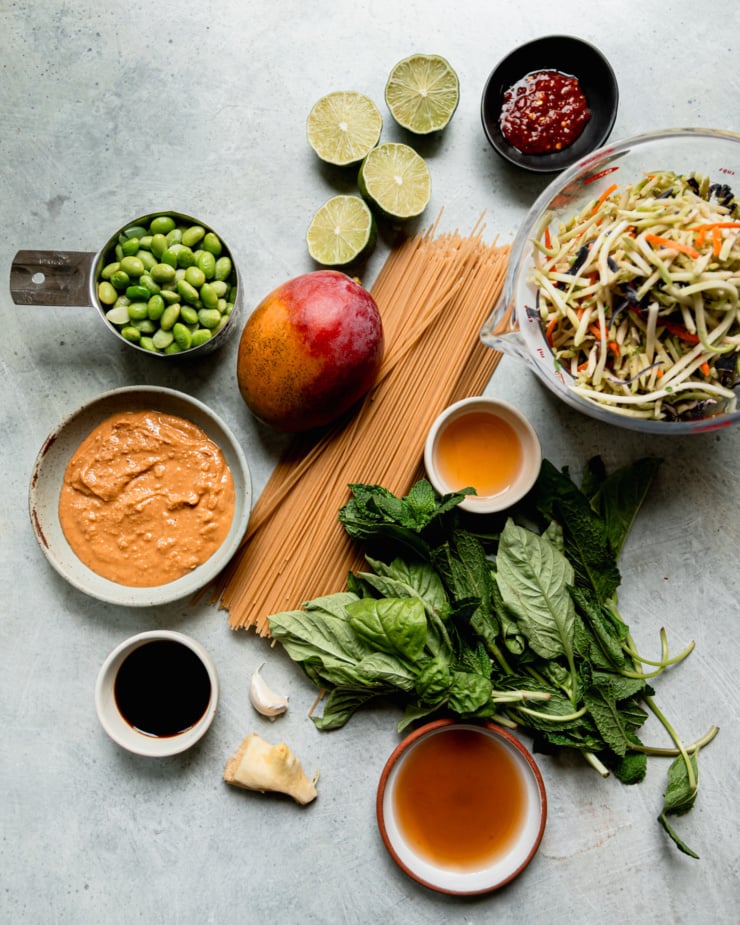 An overhead shot shows ingredients needed for a mango slaw noodle dish.