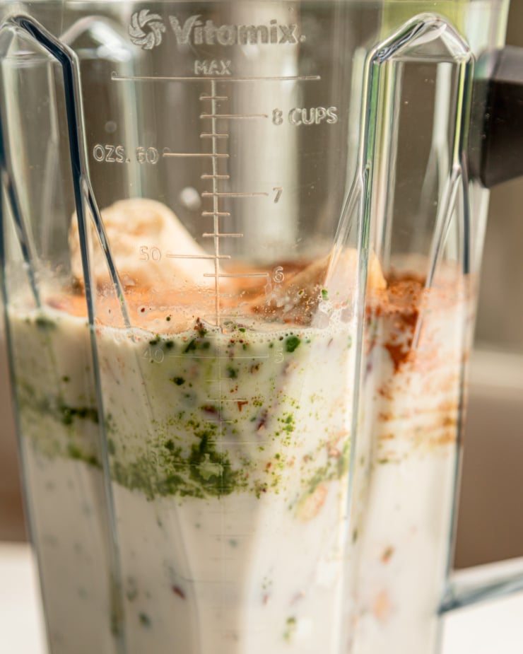 A head-on shot shows ingredients in a blender prior to blending for a smoothie.