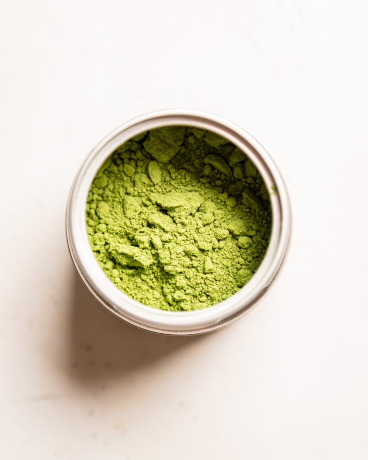 An overhead shot shows a tin of matcha.