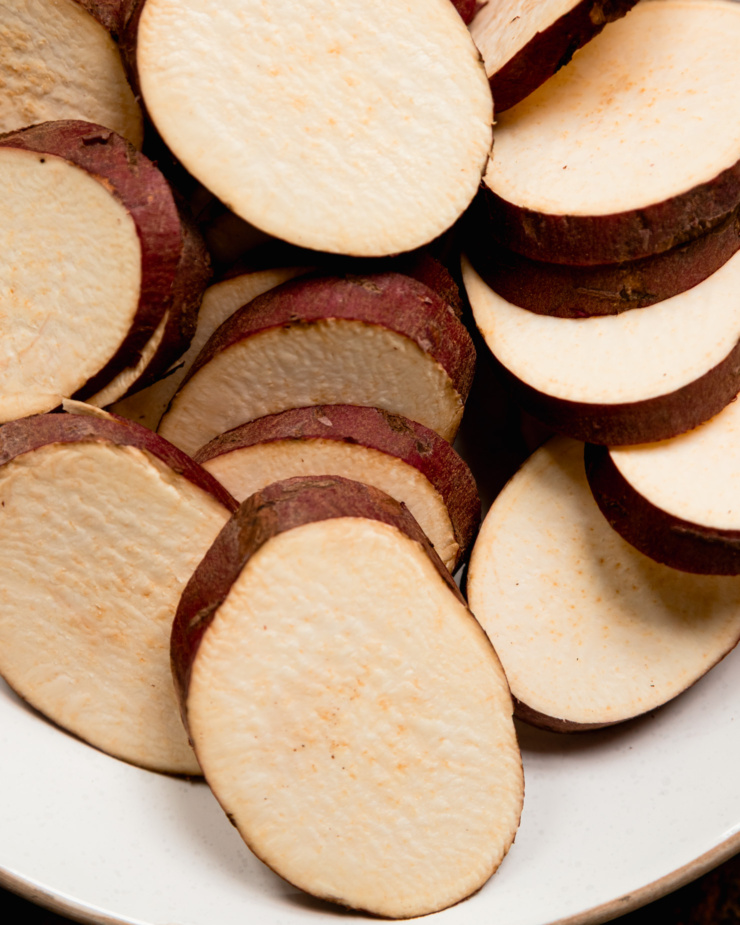 An overhead shot shows sliced Japanese sweet potatoes.