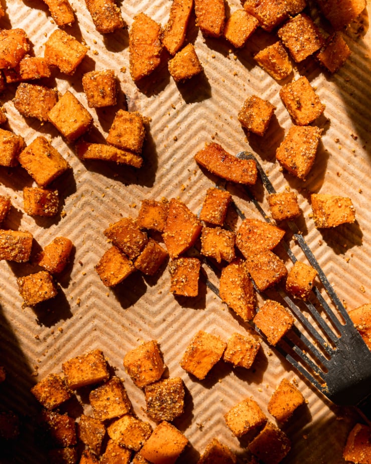 An overhead shot shows roasted butternut squash cubes with spices.