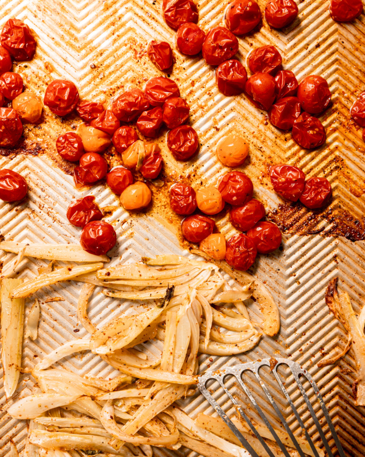 An overhead shot shows roasted cherry tomatoes and fennel on a baking sheet.