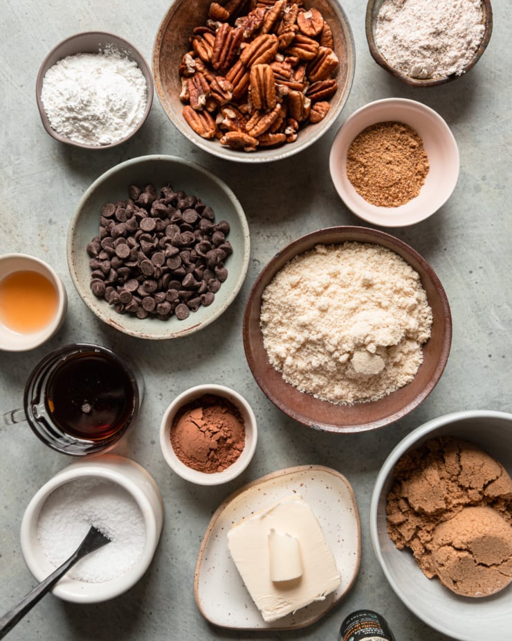An overhead shot shows an assortment of vegan baking ingredients for a bar recipe.