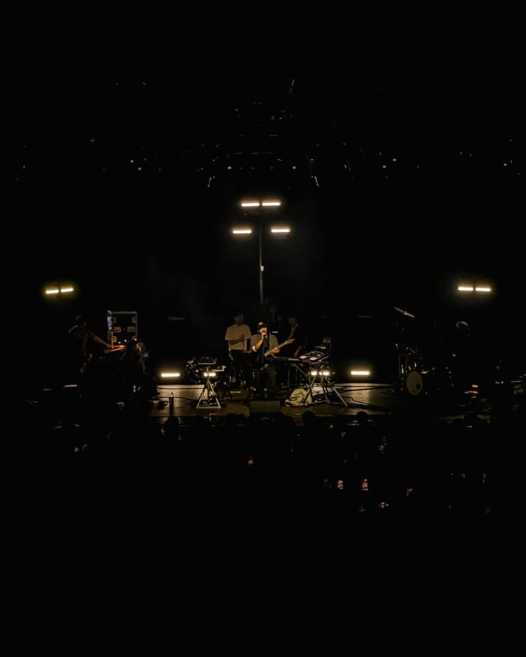A head-on shot shows the artist Dijon performing on stage at Toronto's History venue.